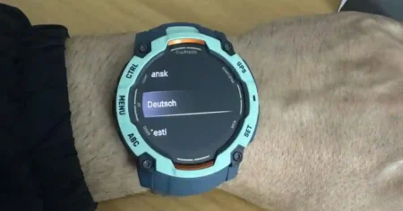 Garmin Instinct 3 beta 10.16 update screen showing new features, bug fixes, and improved tracking for Solar, AMOLED, and Instinct E models