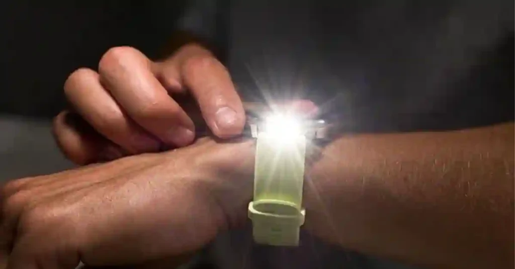 Garmin Venu 4 smartwatch with vivid AMOLED screen and integrated LED flashlight illuminated