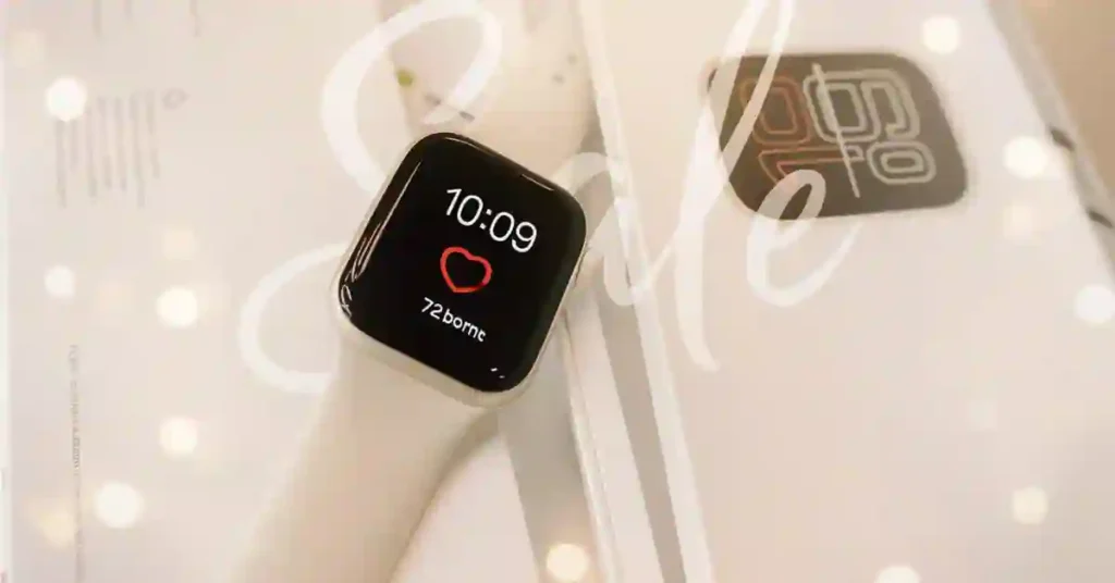 Close-up of the Apple Watch SE 3 (40mm, Starlight) displayed on its packaging, showing the pairing screen—part of Amazon’s limited-time $49.01 discount deal.