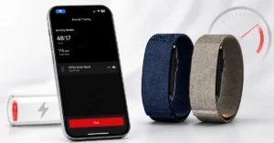 Garmin CIRQA smart bands next to a phone showing the Garmin Connect app with battery percentage, alongside a low-battery warning icon and gauge illustrating fast battery drain
